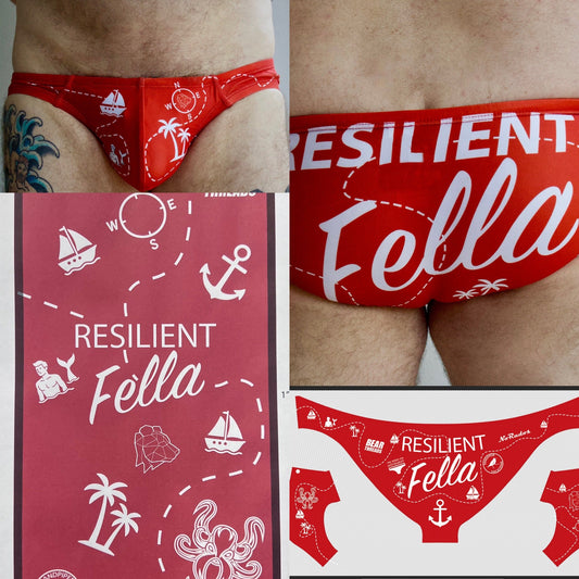 Red men's swimsuit with 'Resilient Fella' branding and nautical designs.