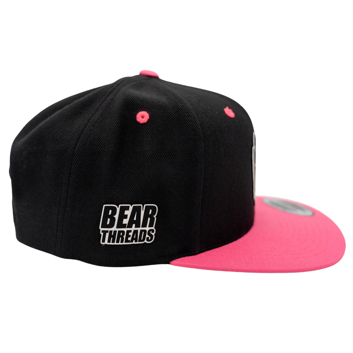 Black and pink cap with 'Bear Threads' logo on a white background
