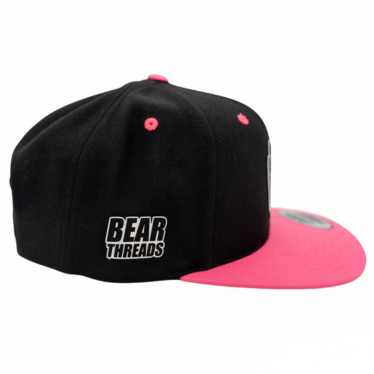 Black and pink cap with 'Bear Threads' logo on a white background